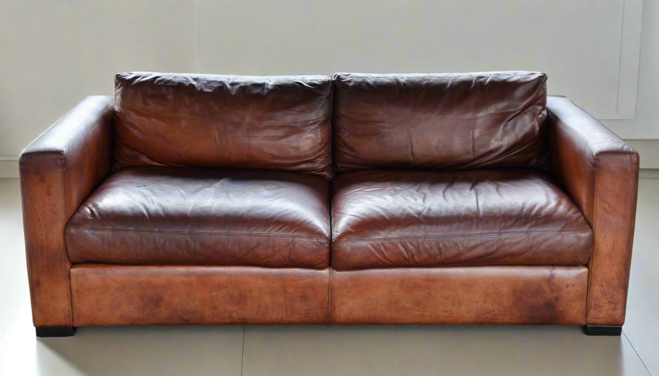 A warm well worn in Leather Sofa