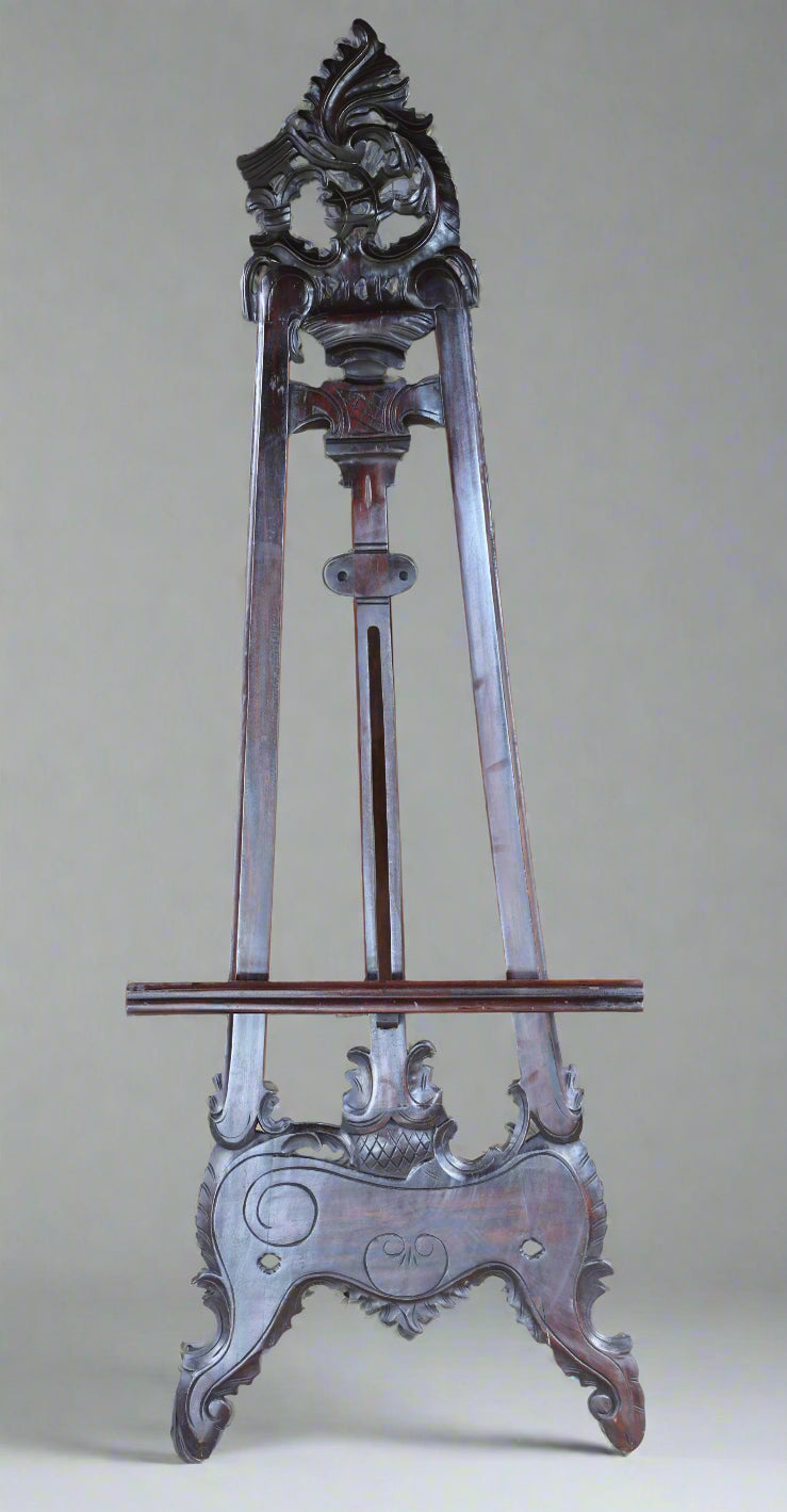 A carved mahogany Easel.