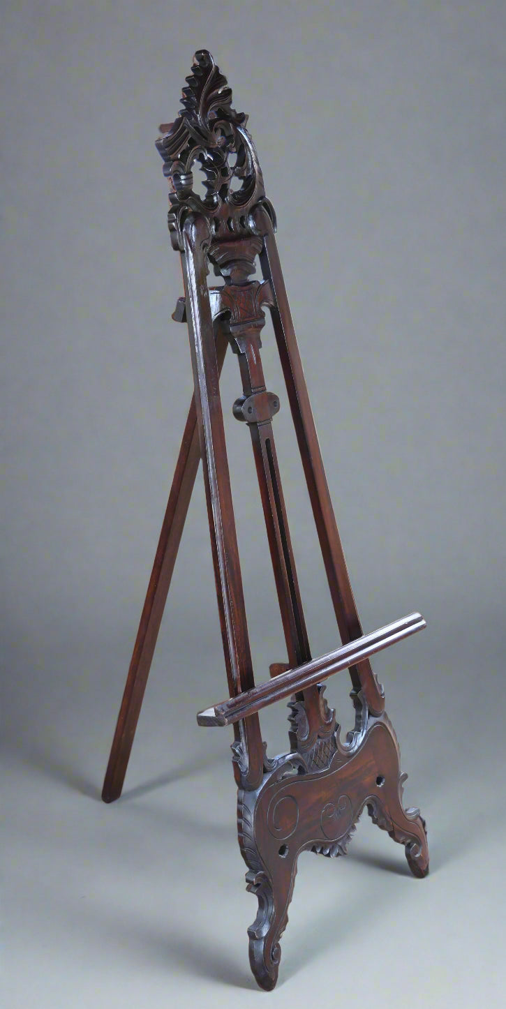 A carved mahogany Easel.
