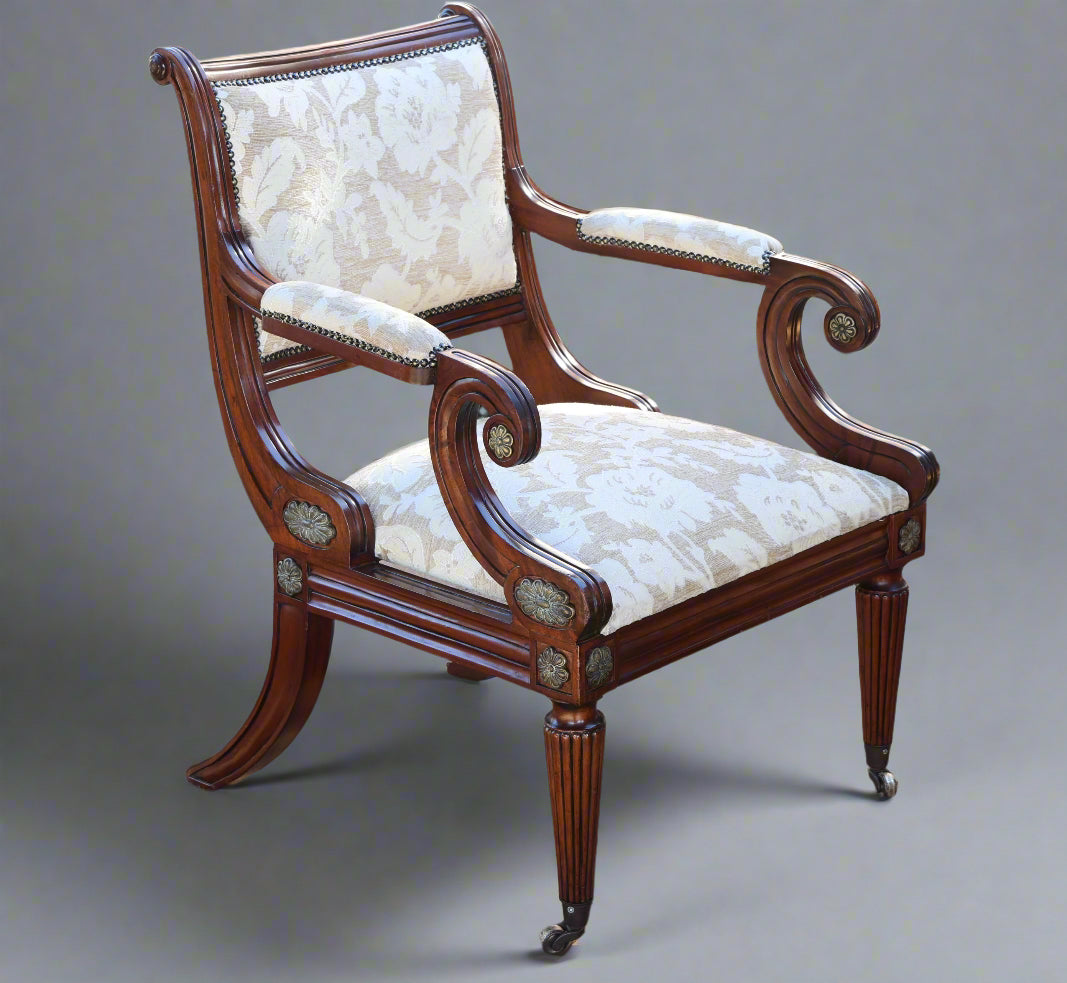 Pair of Empire style mahogany and gilt metal mounted Armchairs