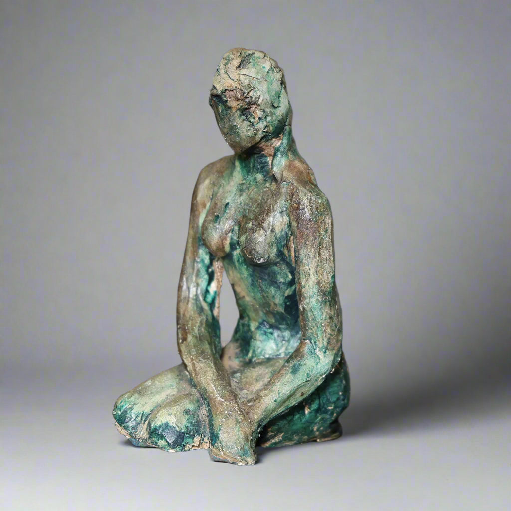 Ceramic sculpture of a kneeling Lady