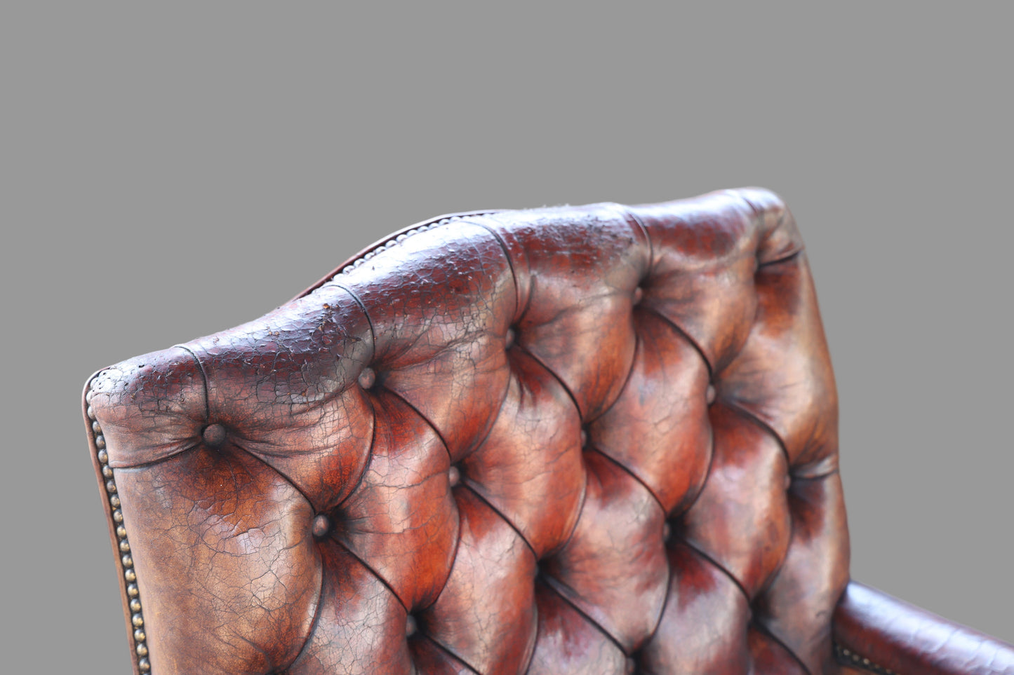 Pair of Georgian mahogany Gainsborough Chairs, upholstered in tufted leather - SOLD