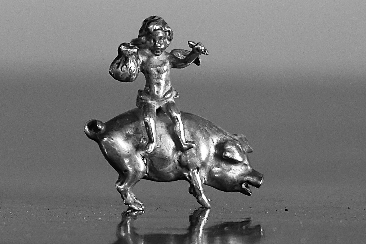 A Miniature silver Pig with a Fairy Rider