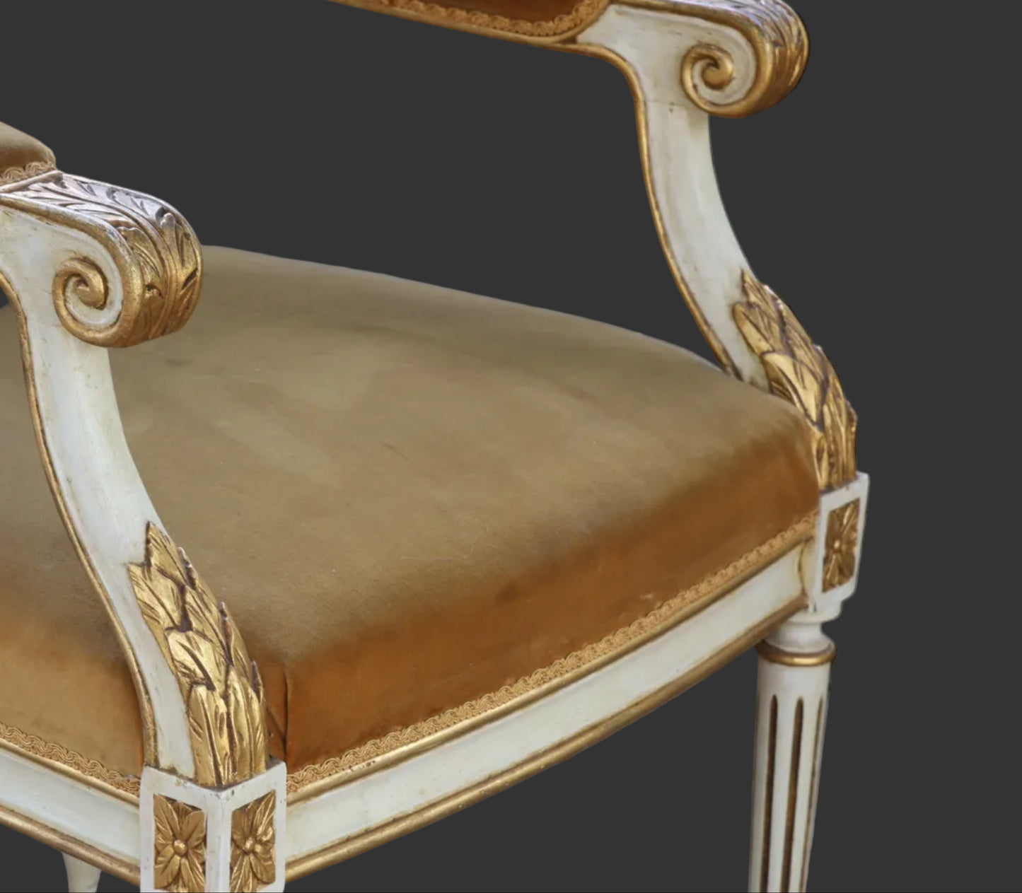 Two Pairs of Neoclassical or Louis XVI style painted and parcel-gilt Open Armchairs