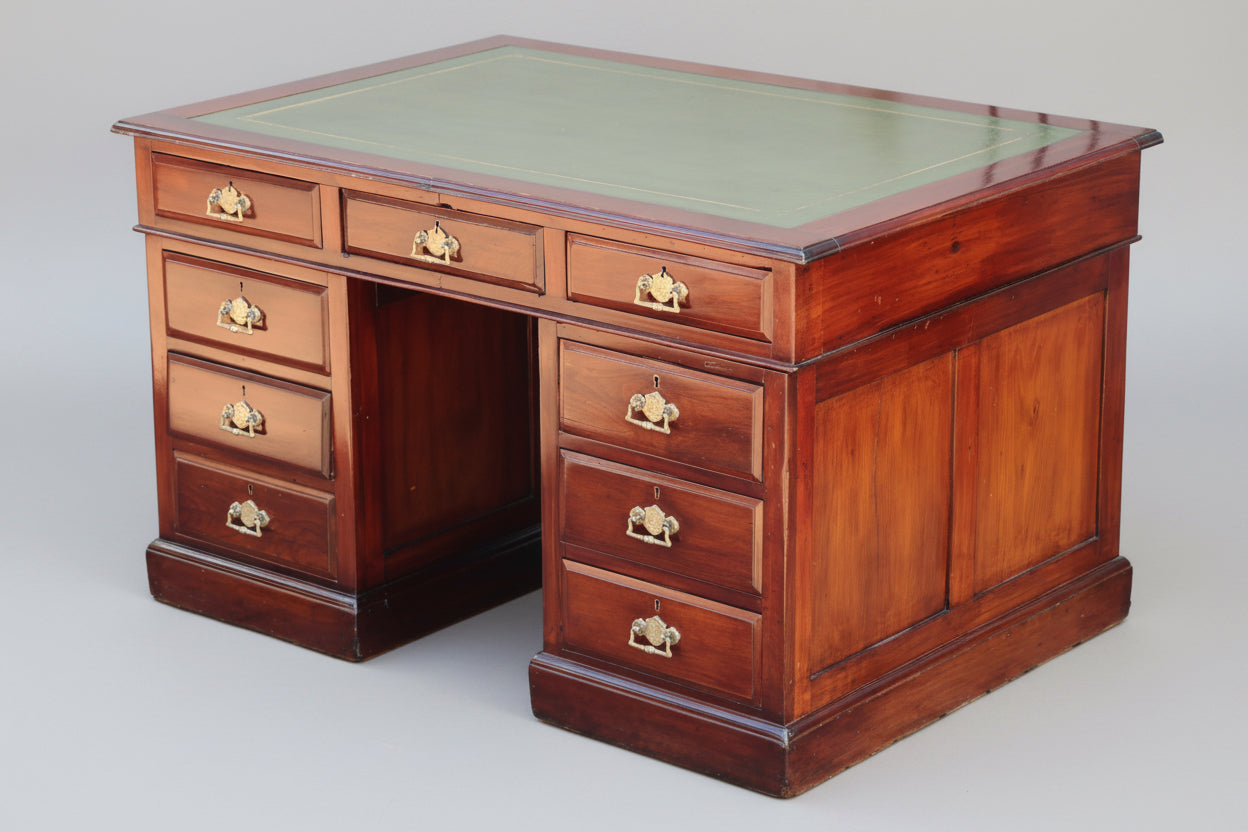 An Edwardian mahogany Pedestal Desk, with tooled leather top.