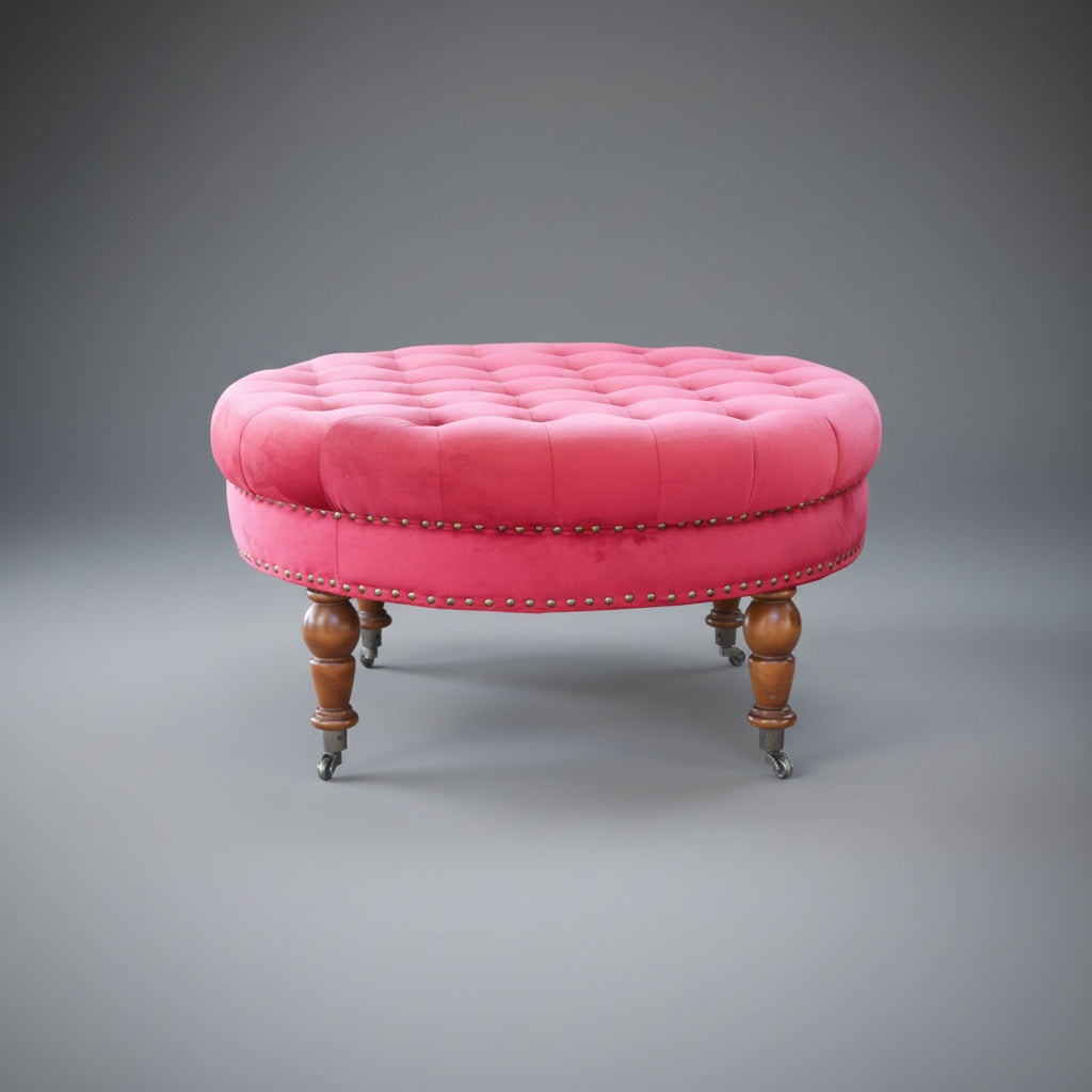 Upholstered Ottoman, on turned legs and castors