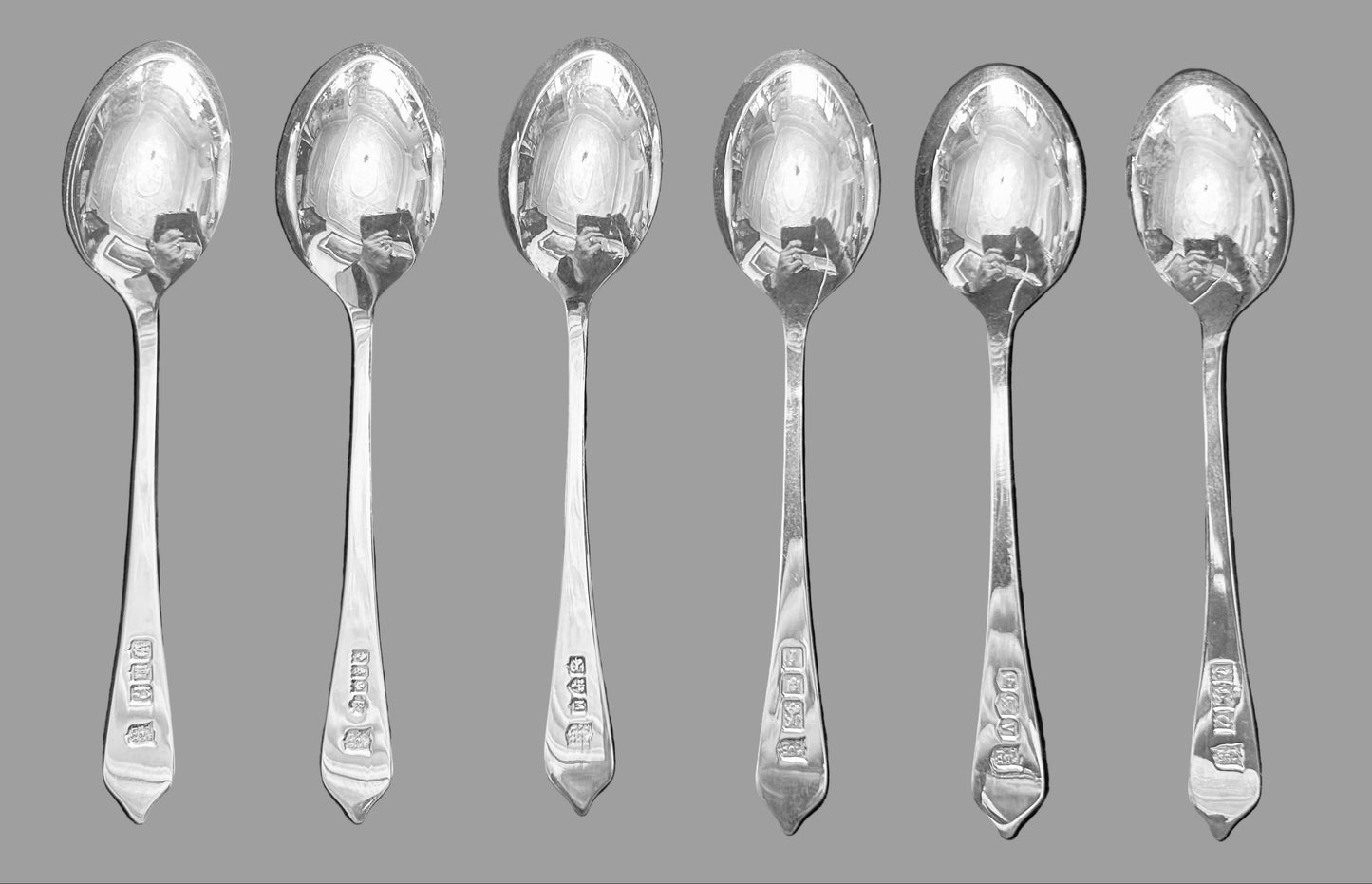 Set of six English Silver Teaspoons in a case with silver hallmarks information.