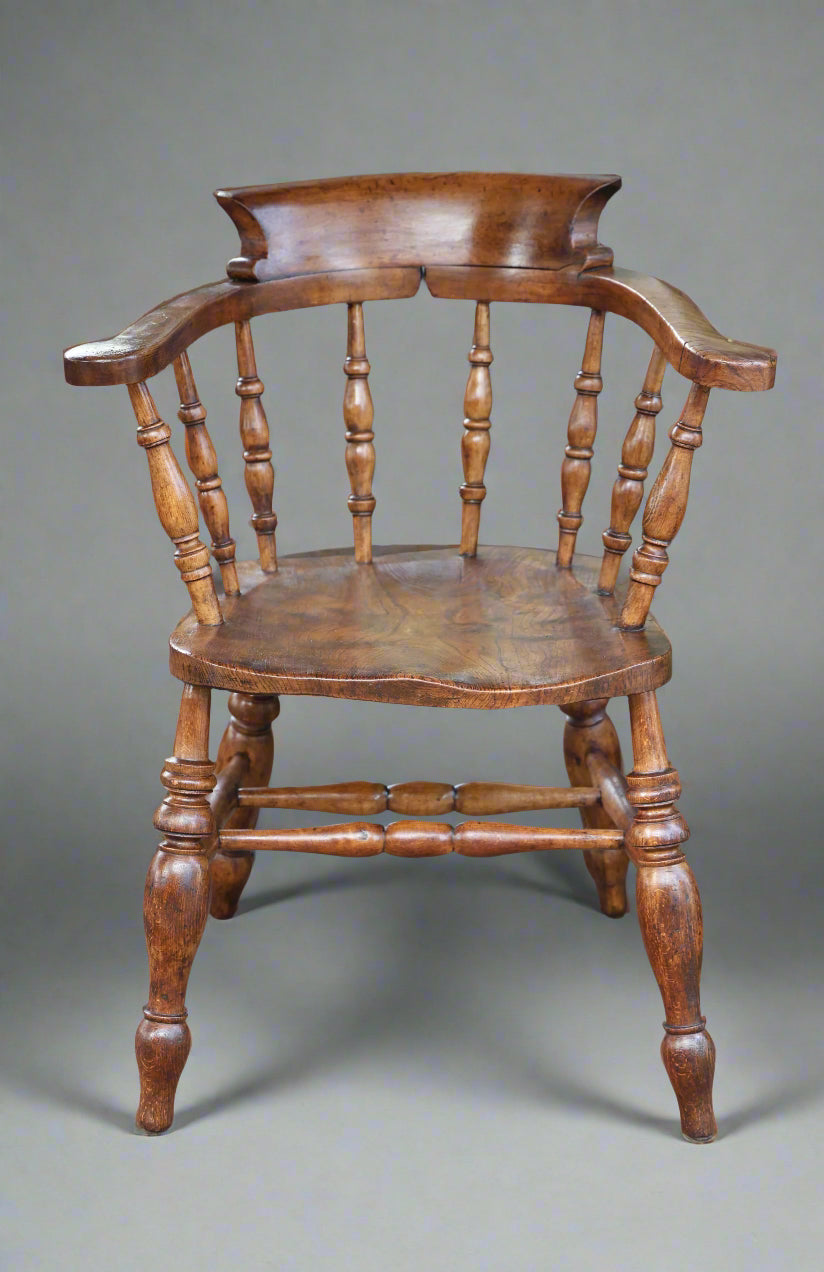 A Victorian elm and beech "Captains" Chair or Smokers Bow Armchair