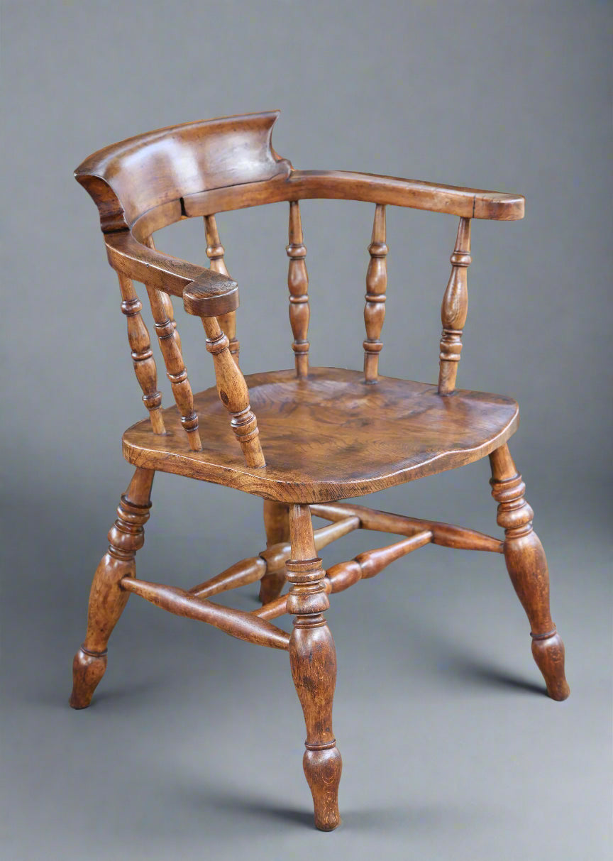 A Victorian elm and beech "Captains" Chair or Smokers Bow Armchair
