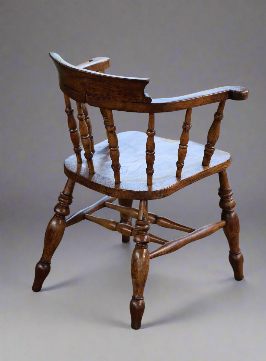 A Victorian elm and beech "Captains" Chair or Smokers Bow Armchair