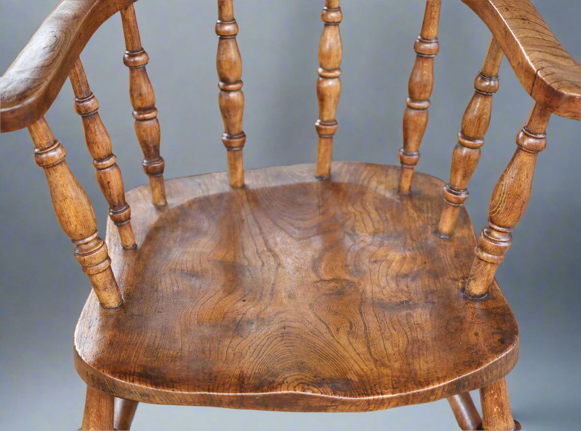 A Victorian elm and beech "Captains" Chair or Smokers Bow Armchair