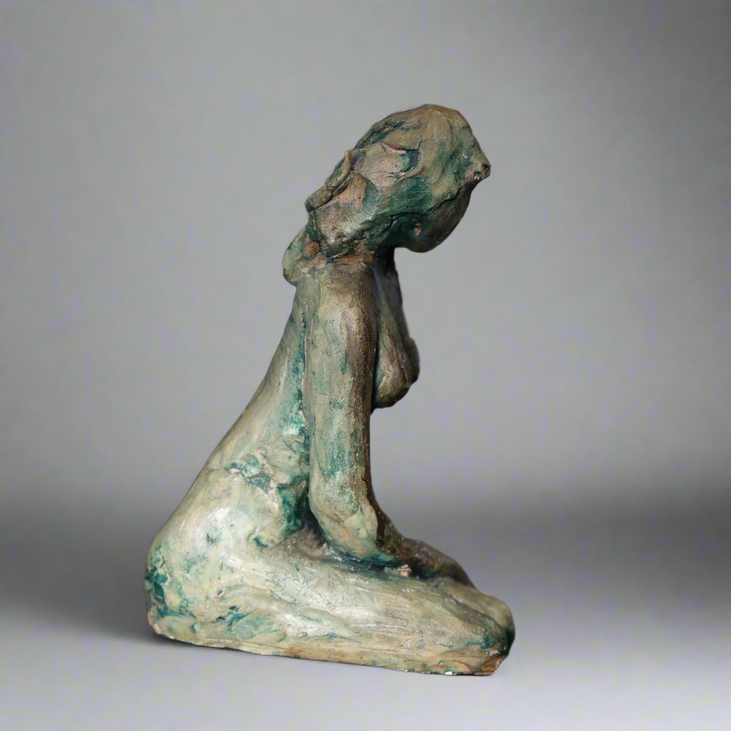 Ceramic sculpture of a kneeling Lady