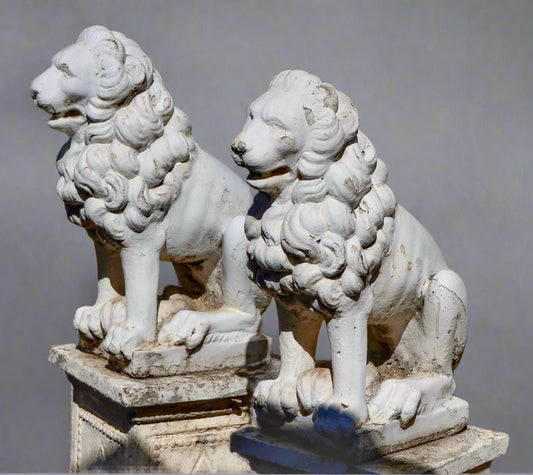 Pair of painted and weathered Concrete Lions on Plinths