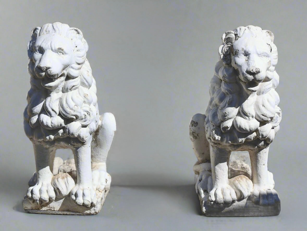 Pair of painted and weathered Concrete Lions on Plinths