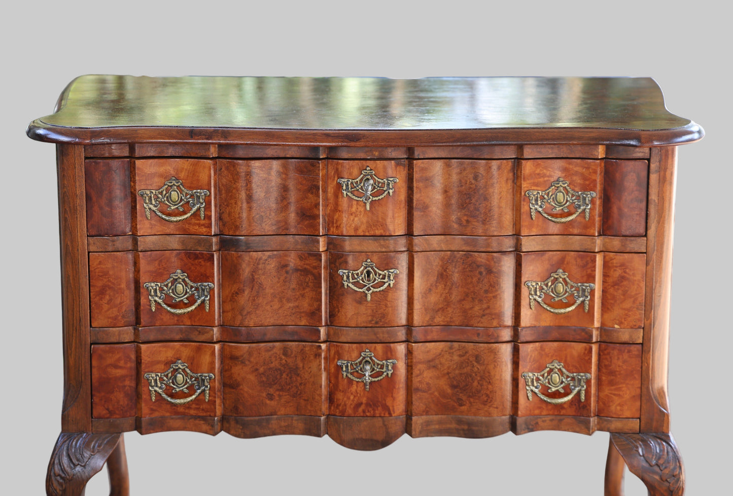 An early 20th Century burr walnut and beechwood Commode