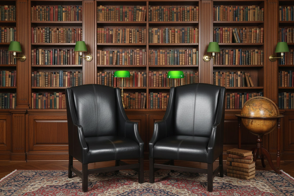 Pair of black leather Armchairs, the back upholstered in Nguni hide.