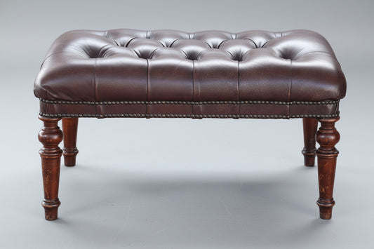 Pair of leather button-upholstered Ottomans