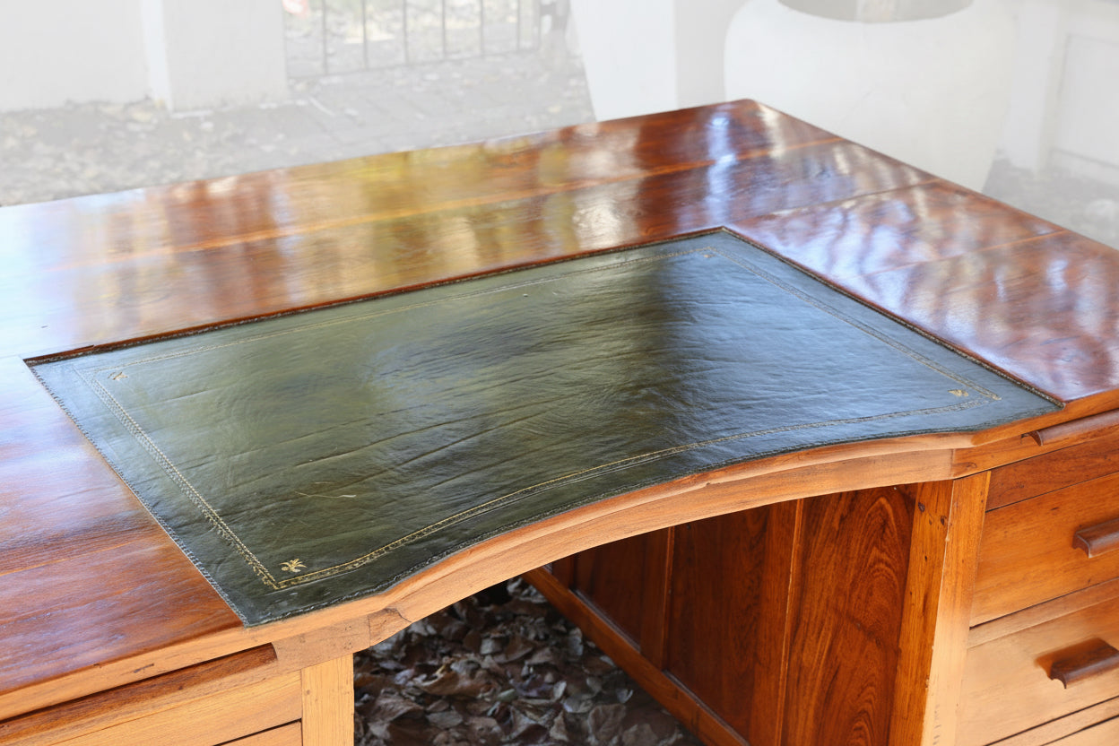 Large teak Partners Desk, with tooled leather section. Early 20th Century