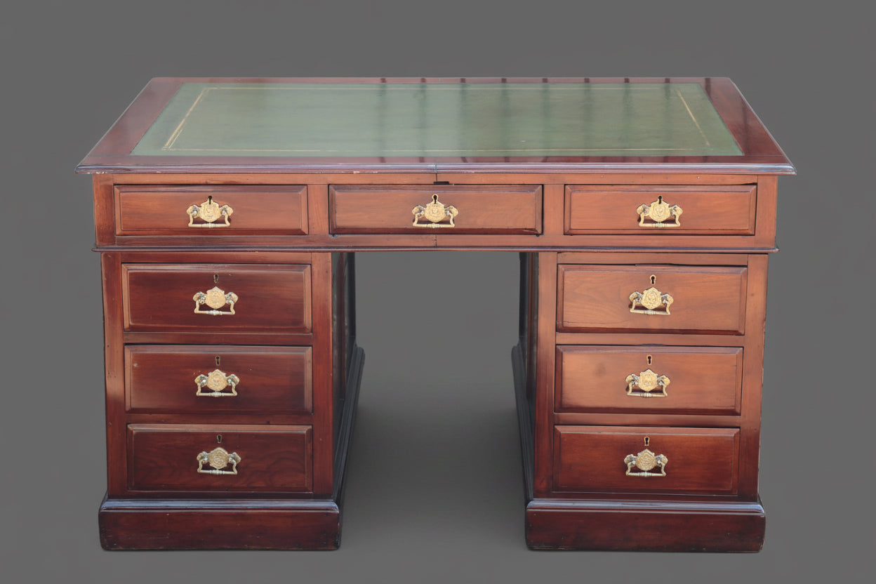 An Edwardian mahogany Pedestal Desk, with tooled leather top.