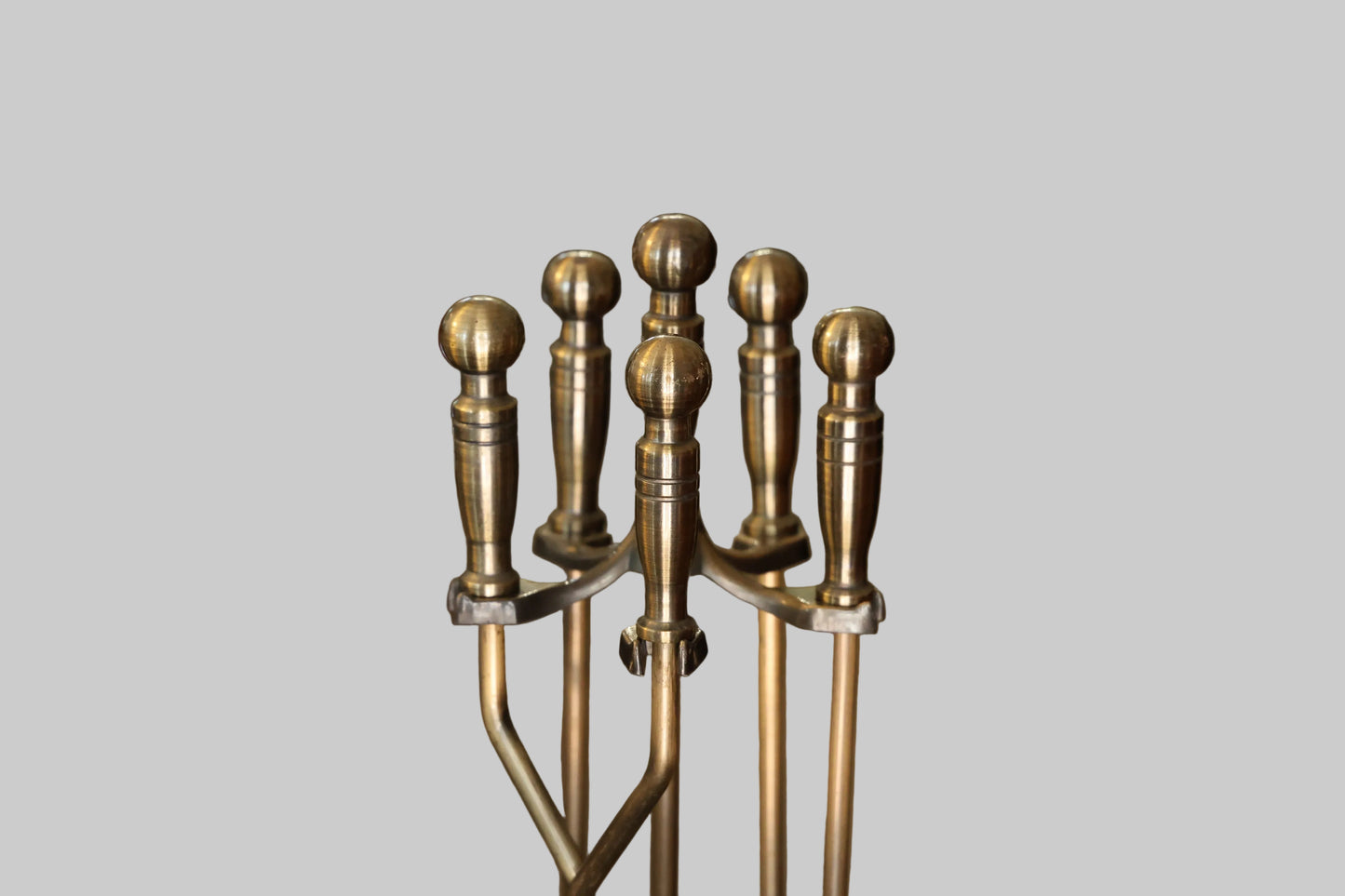 Antiqued brass metal Fire Irons on Stand