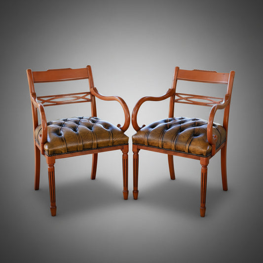 Four pairs of Yewwood and olive button upholstered leather Armchairs