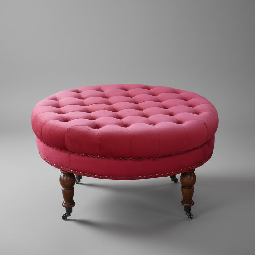 Upholstered Ottoman, on turned legs and castors