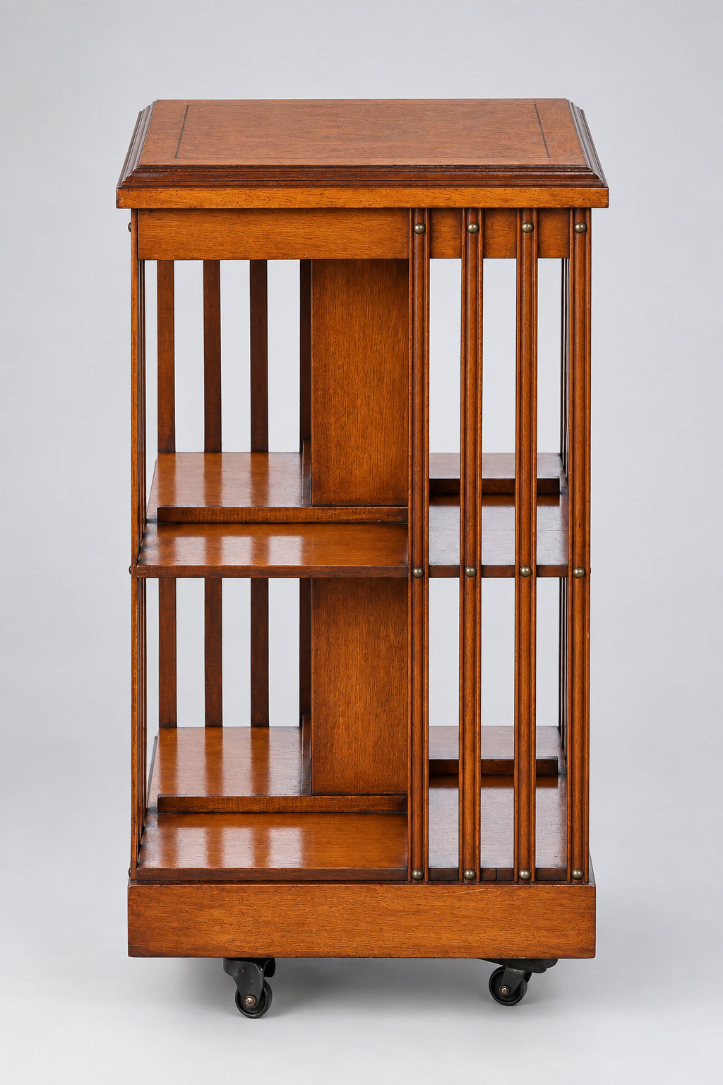 Edwardian maple and mahogany Revolving Bookcase