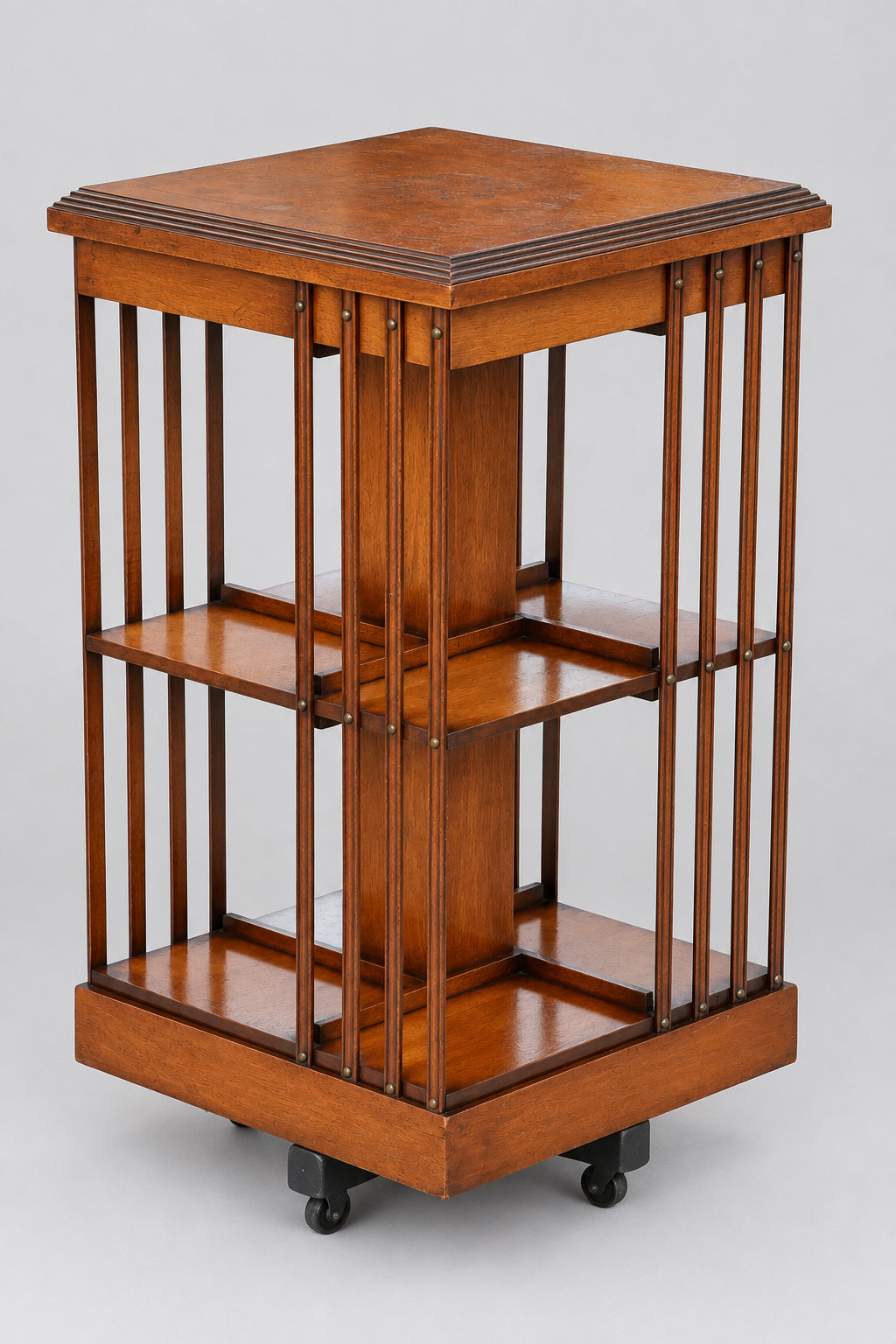 Edwardian maple and mahogany Revolving Bookcase