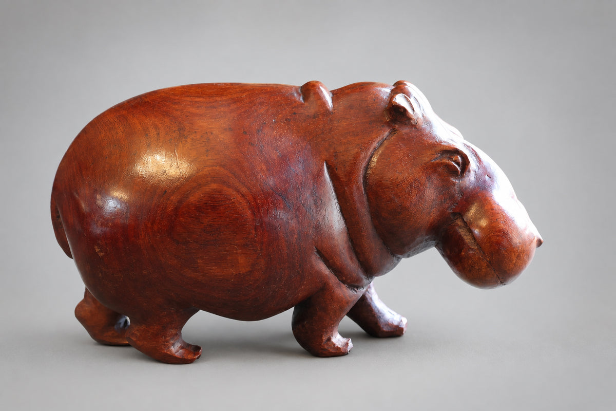 Two hand carved wood Hippos R895 & R1895