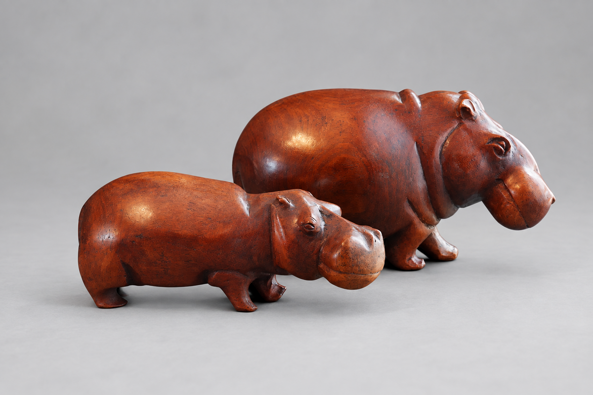 Two hand carved wood Hippos R895 & R1895