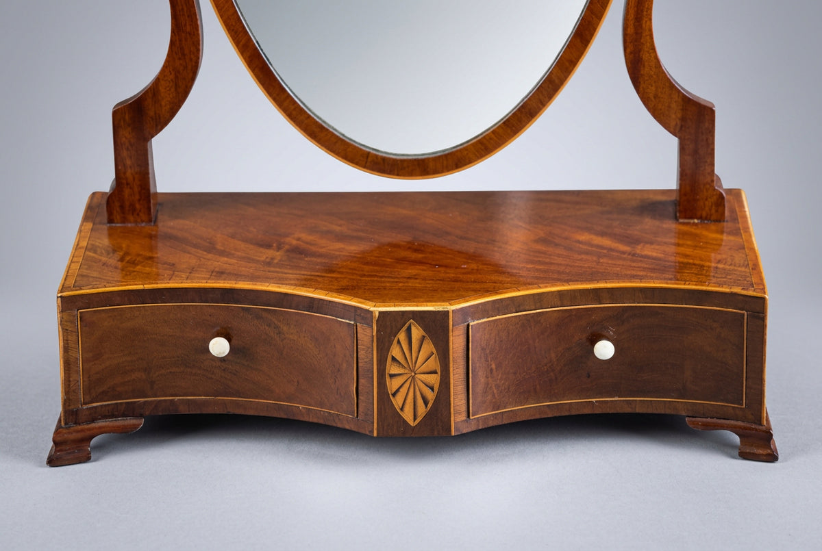 A Georgian mahogany serpentine shaped Dressing Table Mirror - SOLD