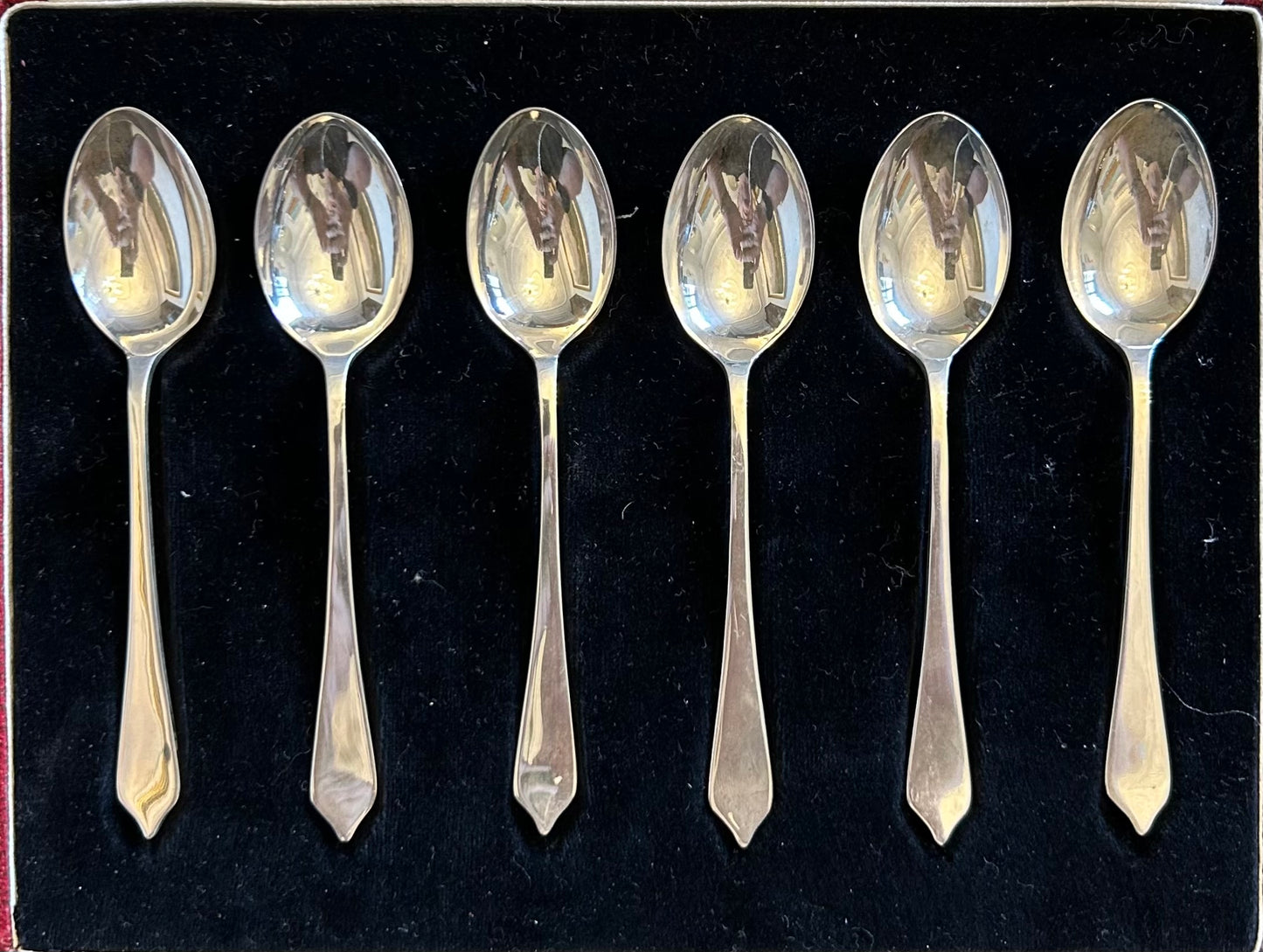 Set of six English Silver Teaspoons in a case with silver hallmarks information.