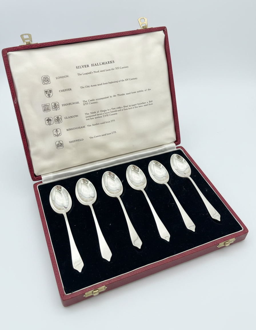 Set of six English Silver Teaspoons in a case with silver hallmarks information.